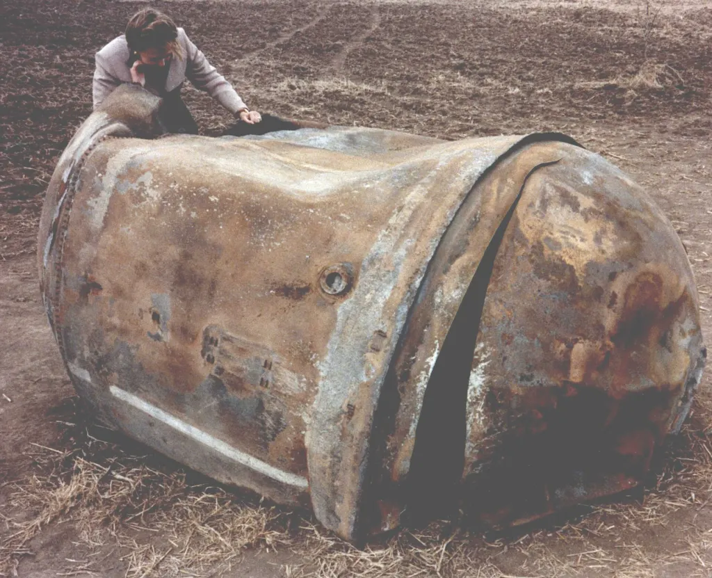 The stainless steel main propellant tank of a Delta 2 rocket's second stage on the ground near Georgetown, Texas, where it landed after re-entry in January 1997