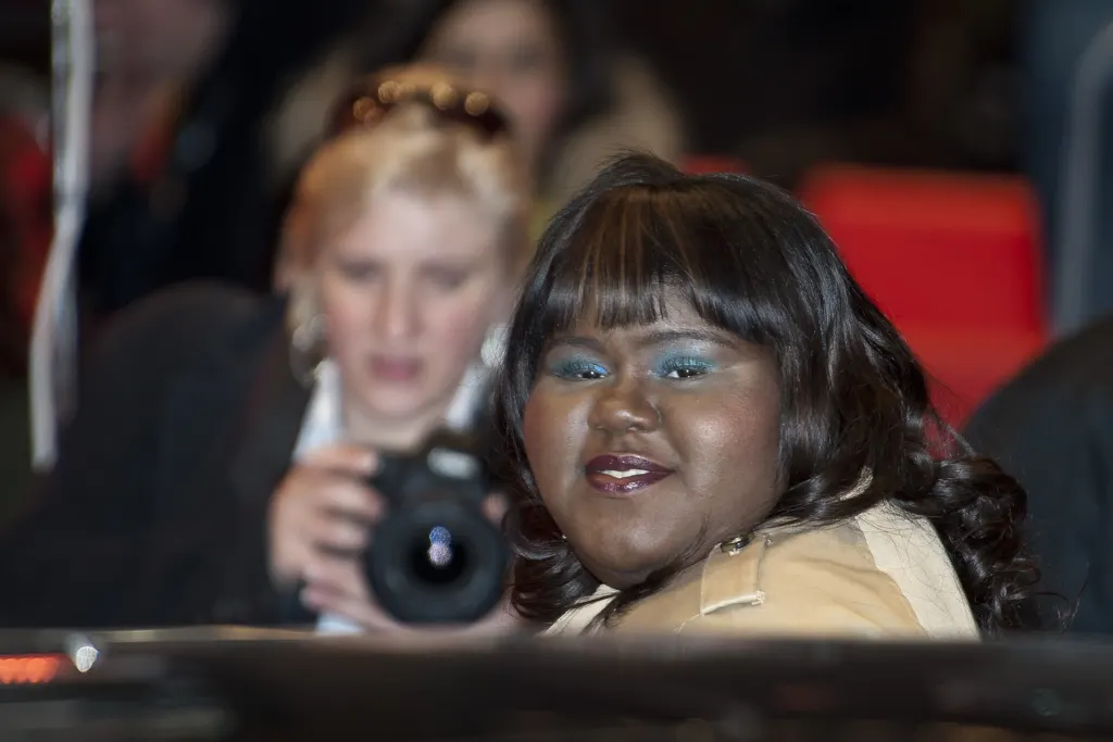 Gabourey Sidibe smiling on the red carpet at the Berlin Film Festival premiere of Yelling to the Sky in 2011