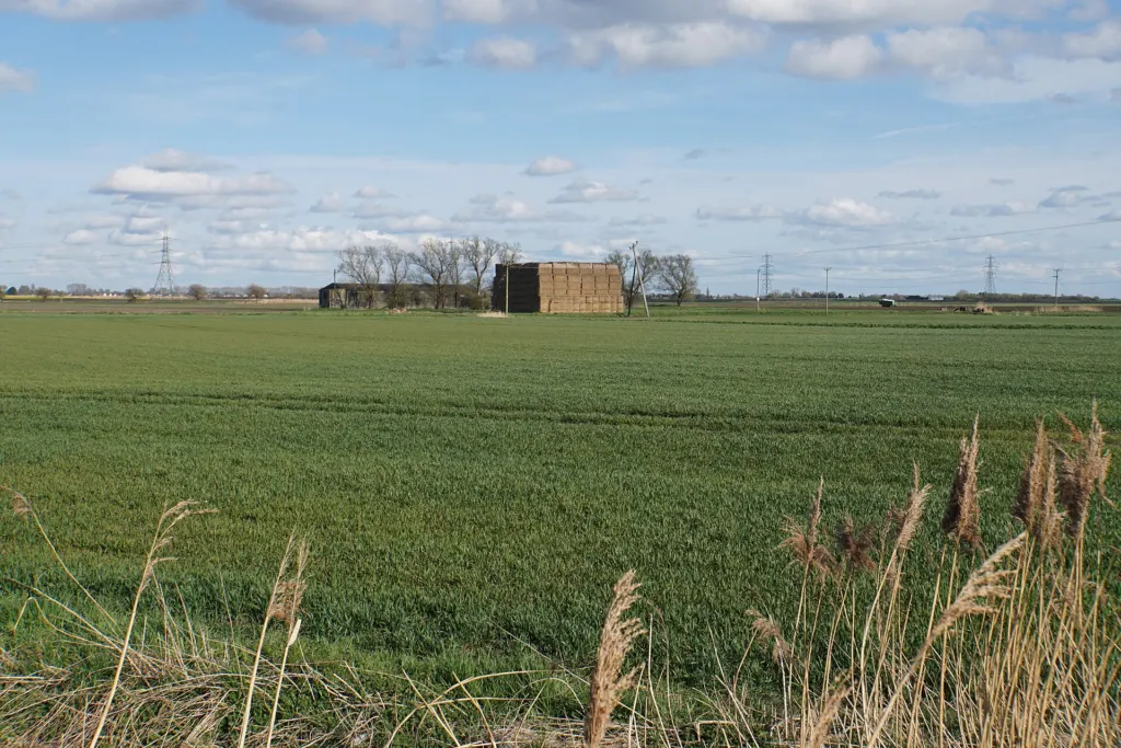 A large haystack standing in a farm field near Crouchmoor Farm in England