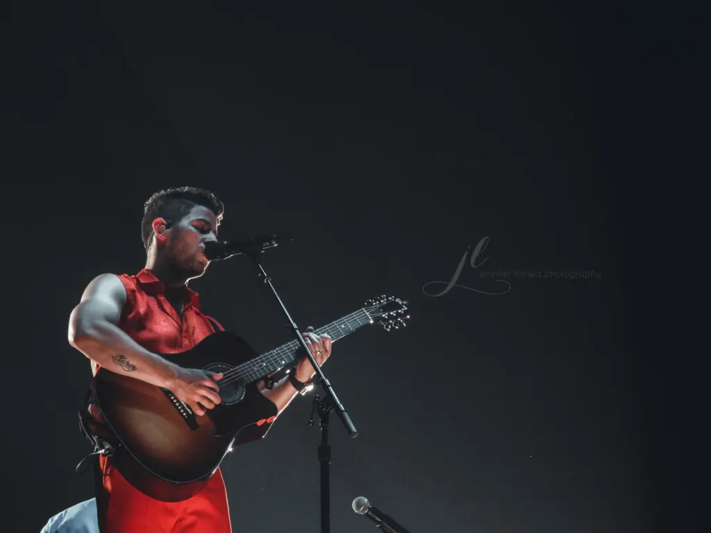 Nick, Joe and Kevin Jonas performing on stage at the Pepsi Center in Denver during their Happiness Begins Tour in October 2019