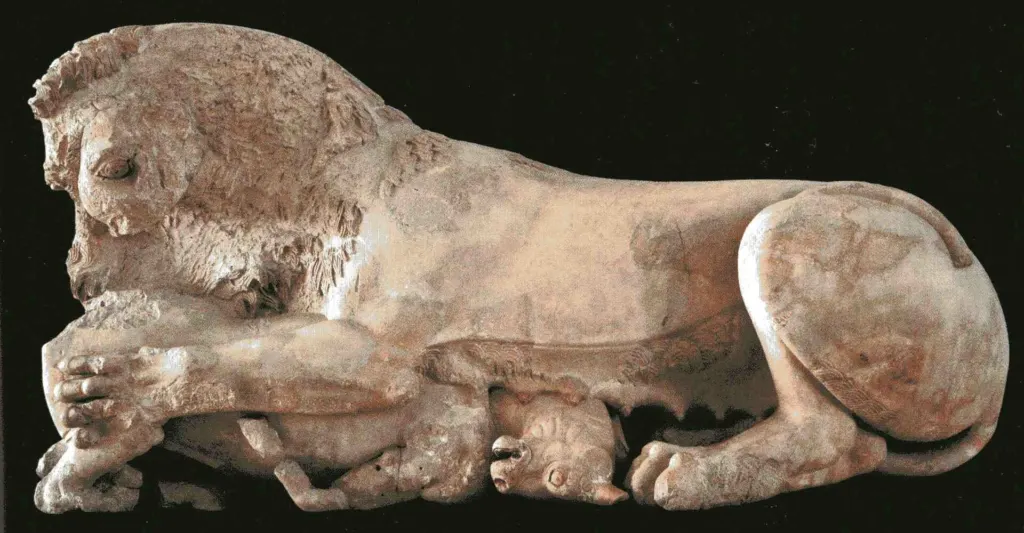 Painted limestone pediment sculpture of a lioness attacking a calf from the Hekatompedon temple, displayed in the Acropolis Museum in Athens