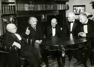 Albert Einstein seated with physicists Walther Nernst, Max Planck, Robert Millikan and Max von Laue at a dinner in Berlin in November 1931