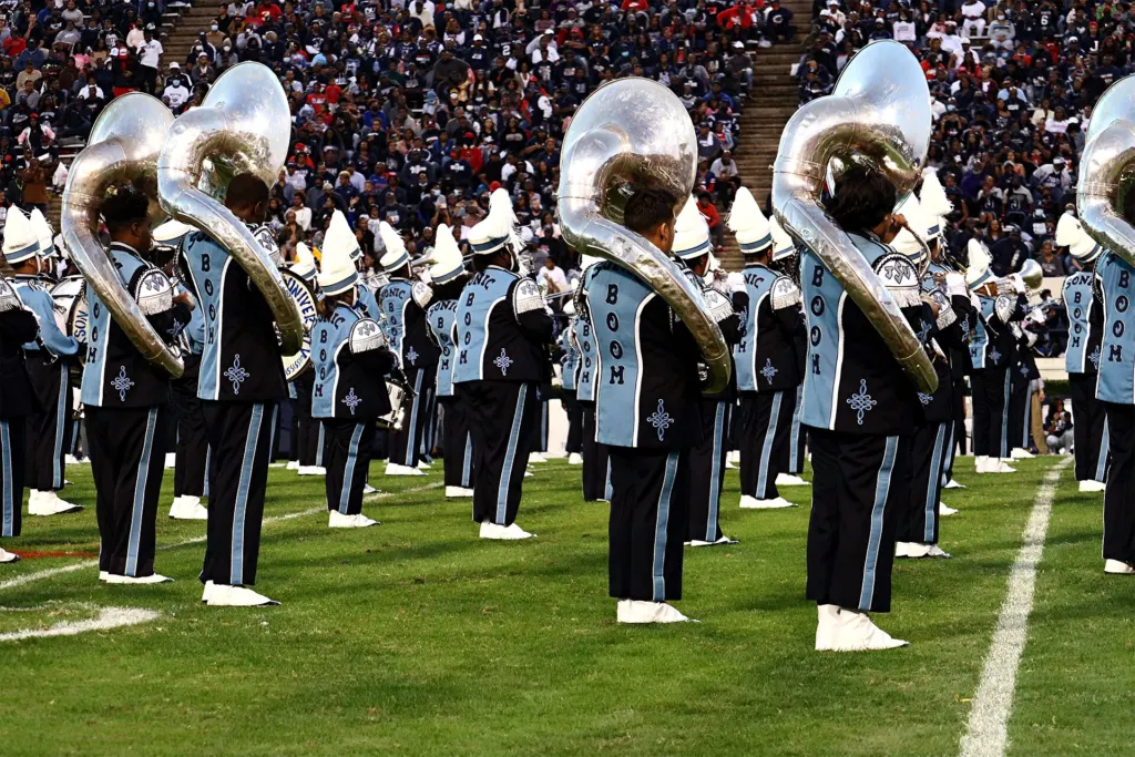 Jackson State University's Sonic Boom of the South marching band in uniform on the field at Mississippi Veterans Memorial Stadium during the 2021 SWAC Football Championship Game