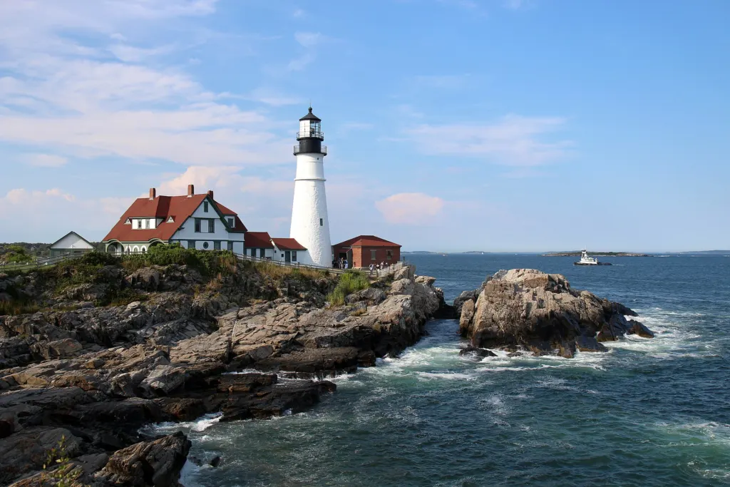 Portland Head Light, a white lighthouse on the rocky coast of Cape Elizabeth, Maine