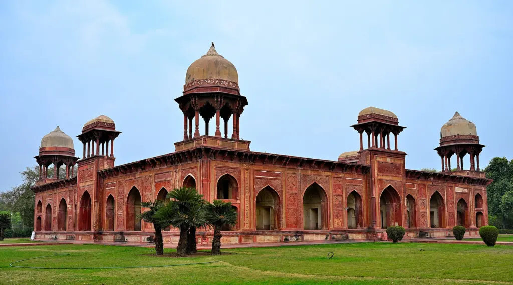 The red sandstone Tomb of Mariam-uz-Zamani at Sikandra near Agra, India, with domed pavilions at its corners