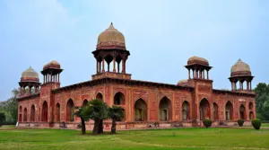 The red sandstone Tomb of Mariam-uz-Zamani at Sikandra near Agra, India, with domed pavilions at its corners
