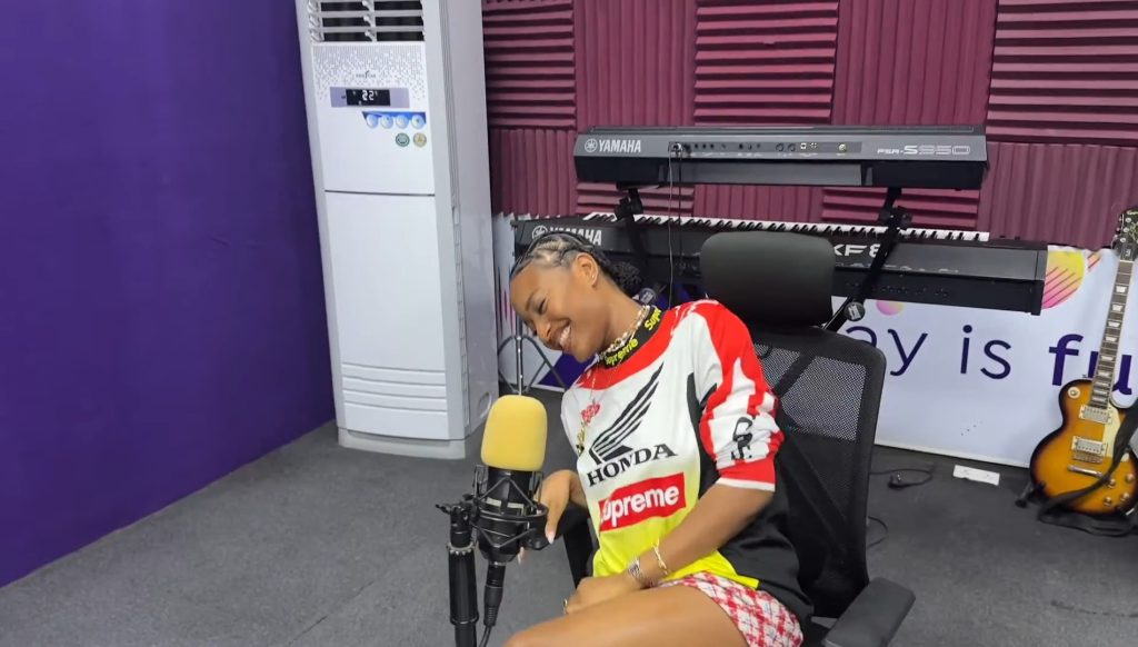 Ayra Starr speaking during a radio interview in Lagos