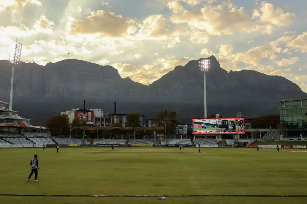 Newlands Cricket Ground in Cape Town during a match, with the pitch, stands and surrounding buildings