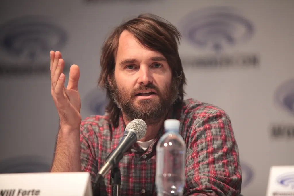 Will Forte speaking into a microphone at WonderCon 2015 at the Anaheim Convention Center in California