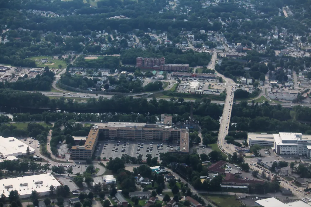 Aerial view of the Queen City Avenue Bridge crossing the Merrimack River in Manchester, New Hampshire