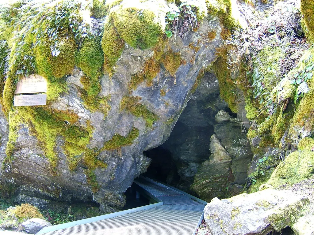 The main entrance of Oregon Caves, where visitors walk over the River Styx stream