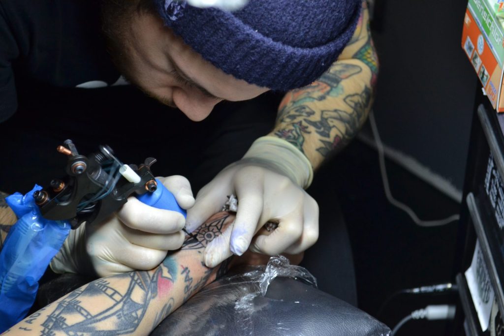 A tattoo artist at work