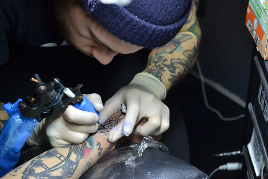 A tattoo artist at work
