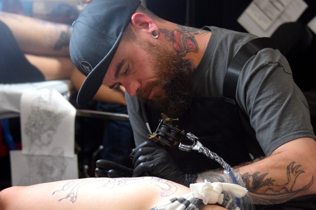 A tattoo artist at work