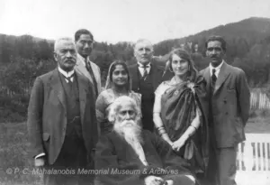 Rabindranath Tagore, white-bearded and seated, with a group of companions in a garden in Oslo, Norway, in 1926