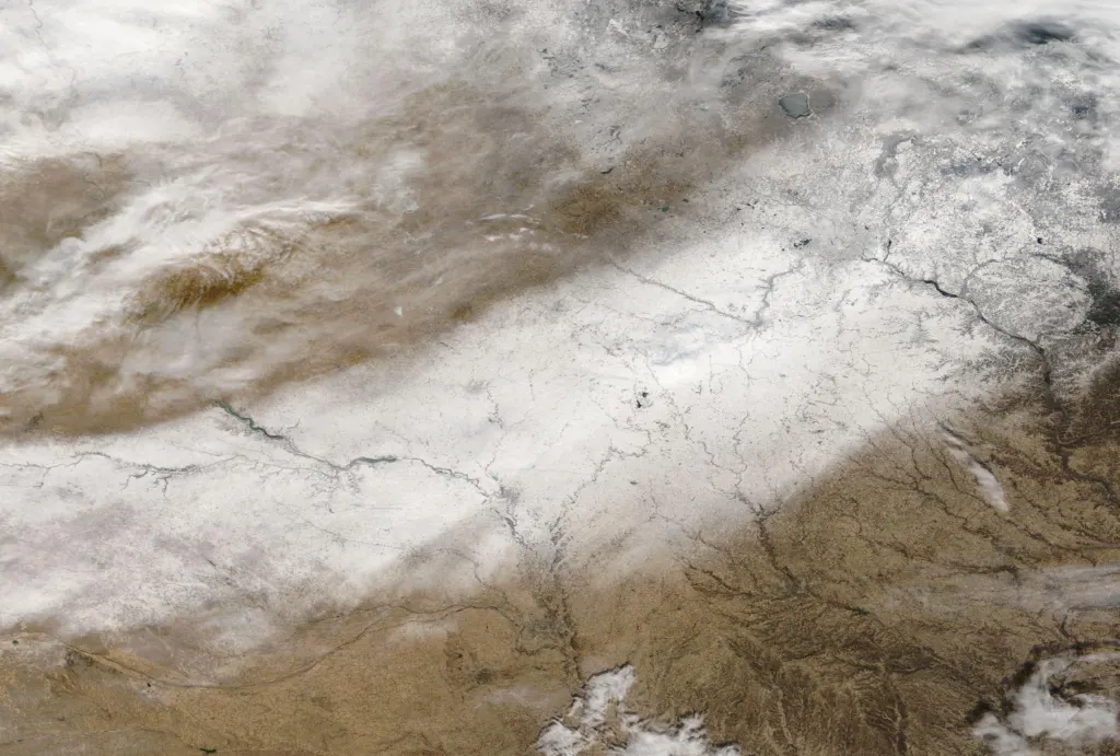 Satellite view of a broad band of snow across the Midwestern United States on December 1, 2022, after a late-November storm